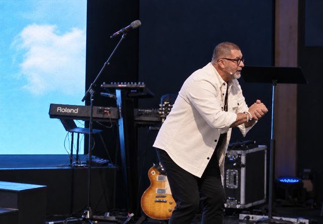 Manny Rivera preaching on stage